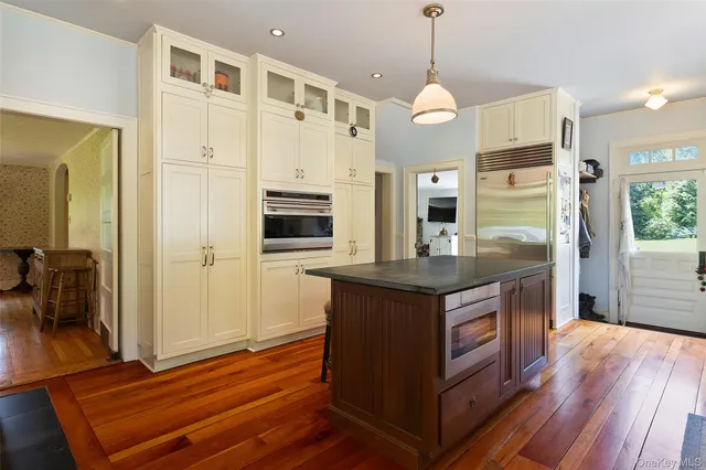 a kitchen with stainless steel appliances granite countertop a stove and a refrigerator