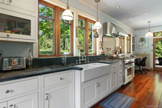 a kitchen with a sink stove and cabinets
