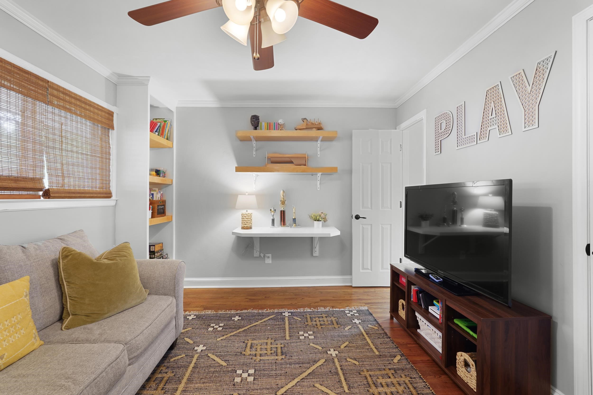 55 Blueberry Road Eads, TN 38028 - Photo 31 of 40 Living area featuring a ceiling fan, wood finished floors, and crown molding
