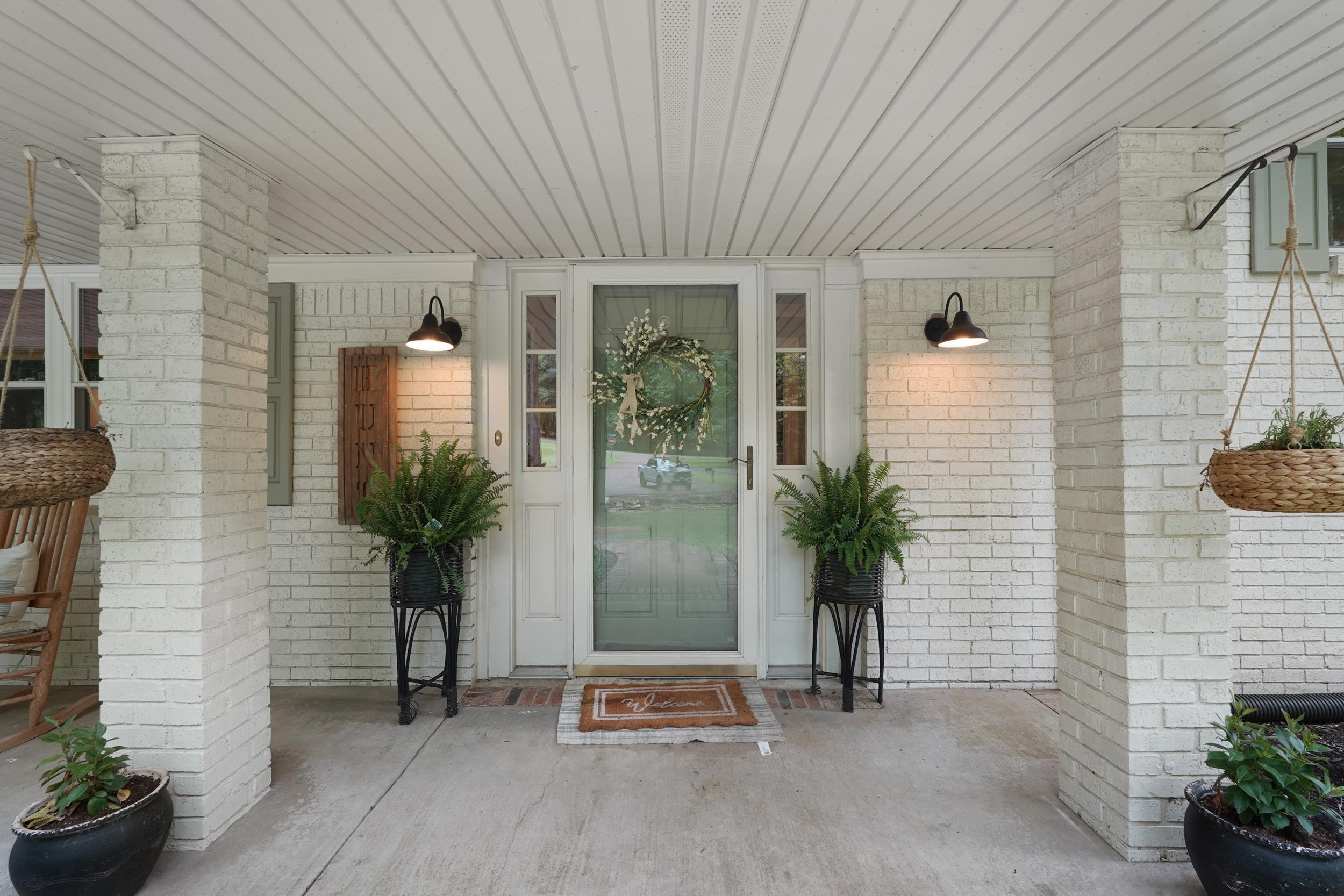 55 Blueberry Road Eads, TN 38028 - Photo 5 of 40 View of exterior entry featuring covered porch and brick siding