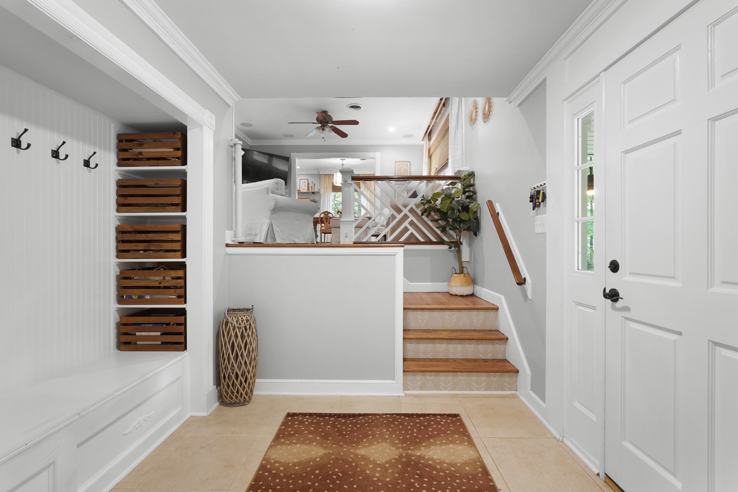 55 Blueberry Road Eads, TN 38028 - Photo 7 of 40 Mudroom featuring ceiling fan, light tile patterned flooring, and ornamental molding