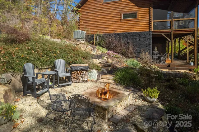 a view of a patio with table and chairs and potted plants