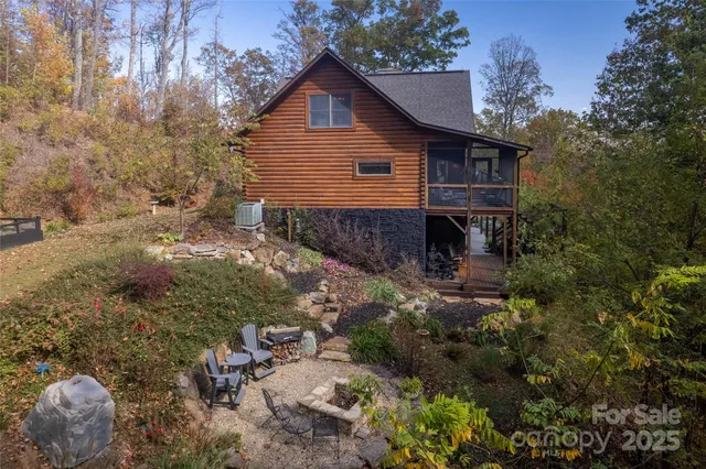 a view of a house with a yard and sitting area