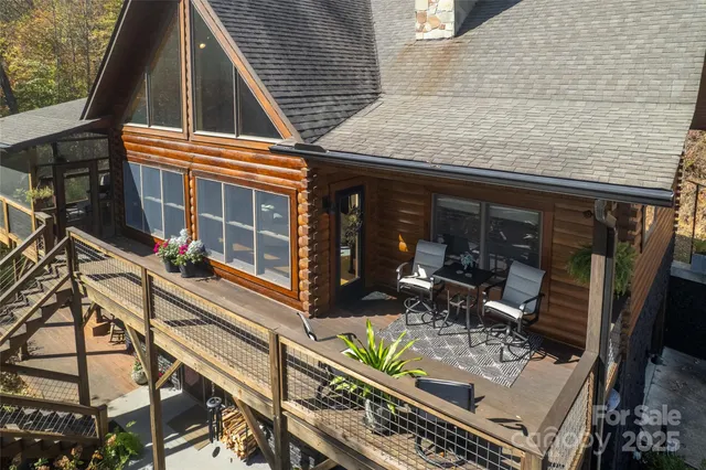 a view of a patio with table and chairs and wooden floor