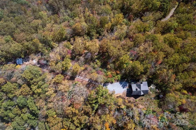 a view of a house with a tree