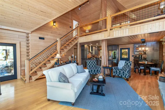 a balcony with furniture and wooden floor