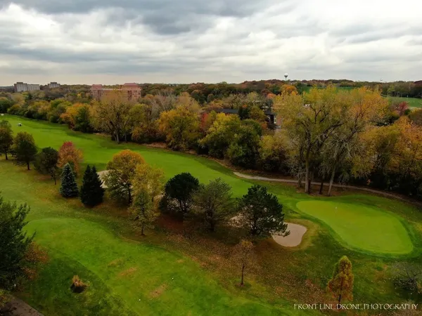 an aerial view of a golf course with a garden
