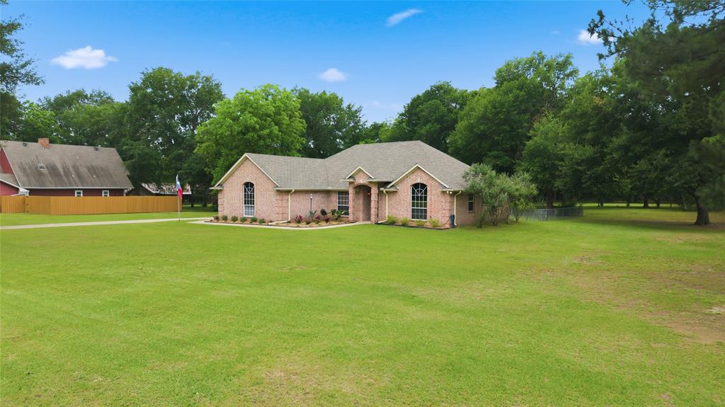 2917 Harlow Road Commerce, TX 75428 - Photo 40 of 40 a view of a house with yard and garden