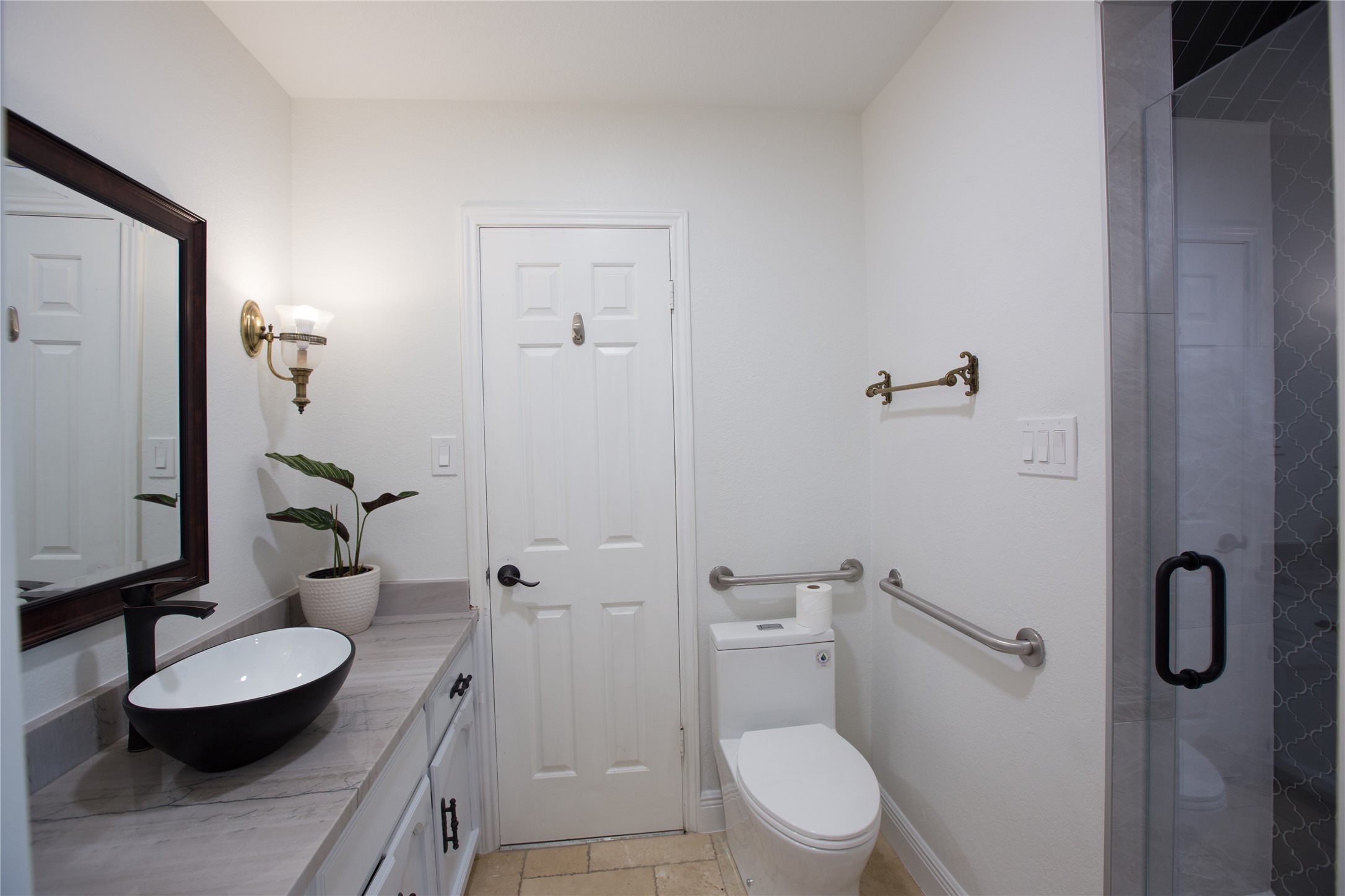 3517 Gattis School Road Round Rock, TX 78664 - Photo 14 of 16 A well-appointed bathroom with a sleek vessel sink and accessible fixtures.