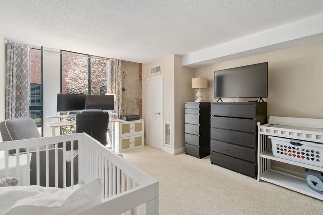 a livingroom with furniture hardwood and a window