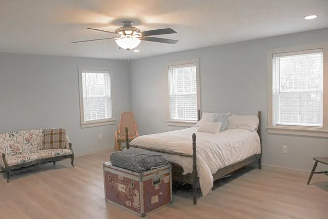 a bedroom with a bed and a couch