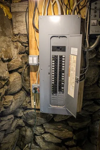 a view of a white house with snow on the road