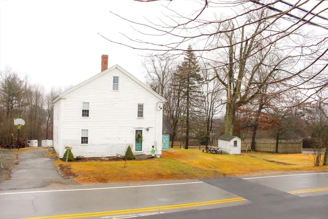 a view of a swimming pool with an outdoor seating and a yard