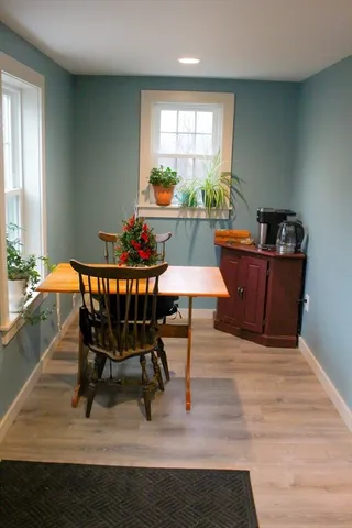 a dining room with furniture and window