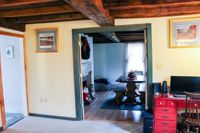 a view of a livingroom with workspace and a couch
