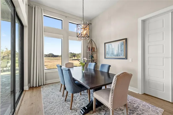 a spacious bathroom with a double vanity sink a mirror a bathtub and shower