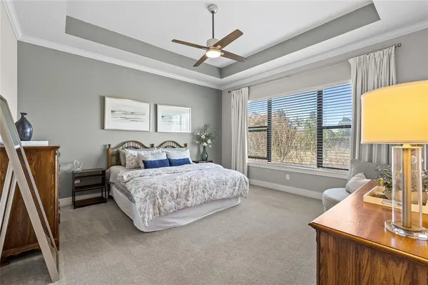 a spacious bathroom with a granite countertop sink mirror and a