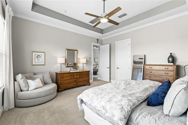 a bathroom with a granite countertop sink a mirror and a bathtub