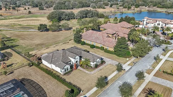 an aerial view of a house with a ocean view
