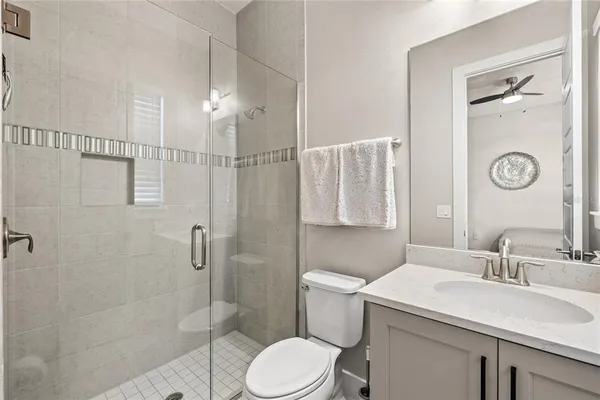 a front view of a house with sitting area and garden