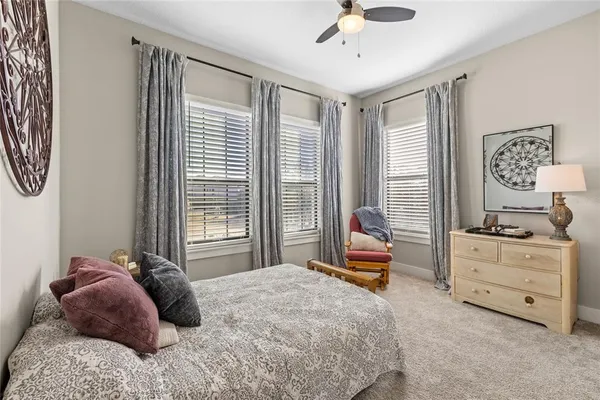 a view of a house with swimming pool and sitting area