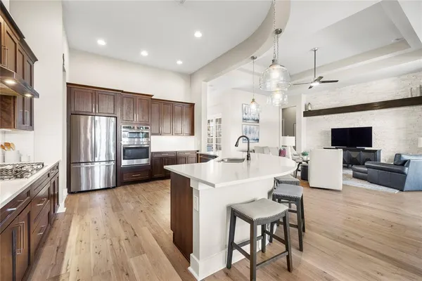 a living room with furniture large window and a flat screen tv