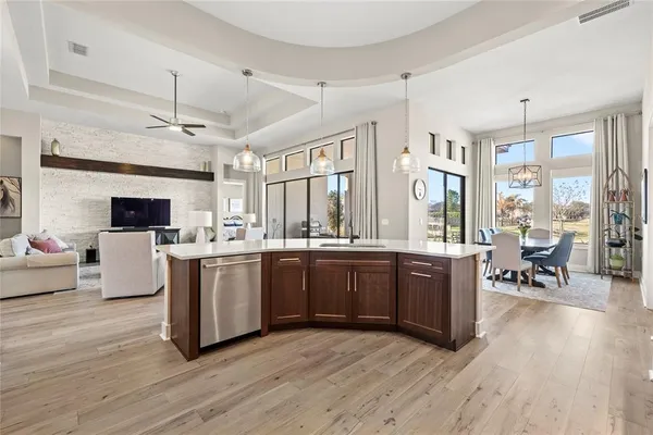 a living room with fireplace furniture and a flat screen tv