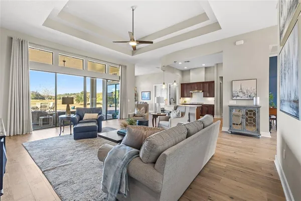 a kitchen with stainless steel appliances kitchen island granite countertop a refrigerator and a stove top oven