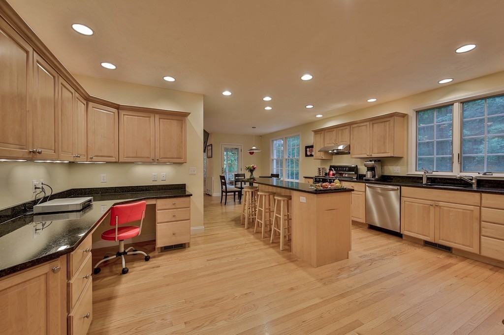 126 Taylor Road Stow, MA 01775 - Photo 4 of 16 a kitchen with stainless steel appliances granite countertop a stove a sink and a refrigerator