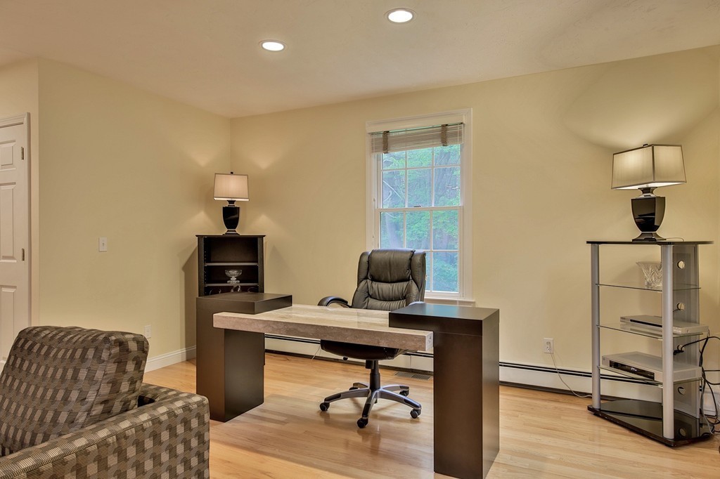 126 Taylor Road Stow, MA 01775 - Photo 8 of 16 a view of a workspace with furniture and a window