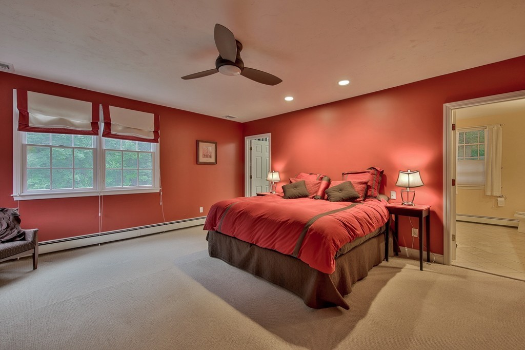 126 Taylor Road Stow, MA 01775 - Photo 9 of 16 a spacious bedroom with a bed and a ceiling fan