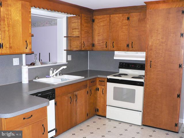 111 Brubaker Road Lititz, PA 17543 - Photo 2 of 3 a kitchen with a sink stove and cabinets