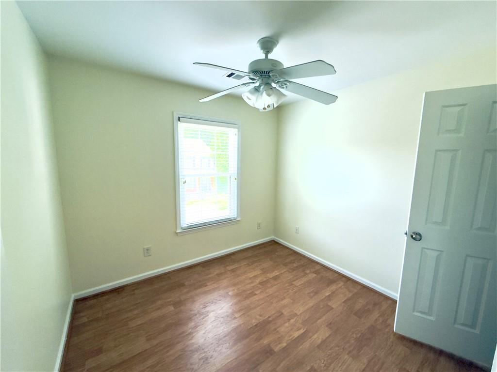 1035 Prestwyck Court Alpharetta, GA 30004 - Photo 17 of 21 an empty room with a window and a fan