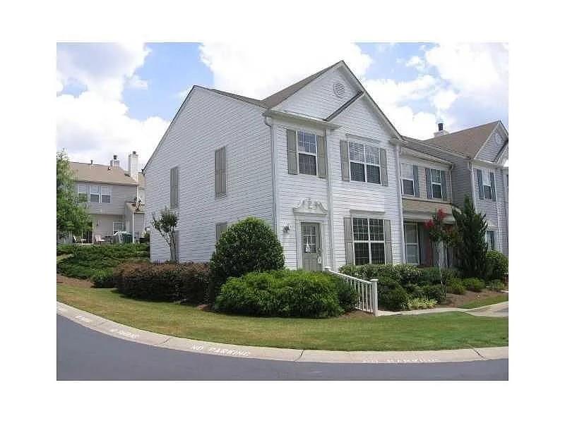 1035 Prestwyck Court Alpharetta, GA 30004 - Photo 2 of 21 a front view of a house with a yard