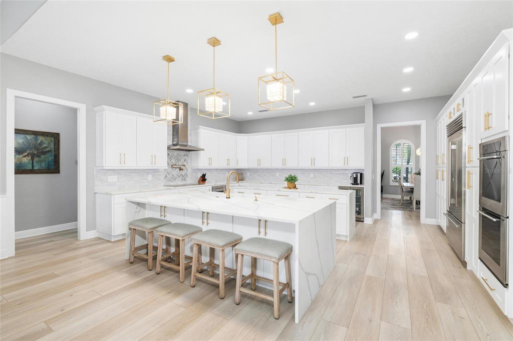 9810 Compass Point Way Tampa, FL 33615 - Photo 13 of 81 a large kitchen with a table and chairs