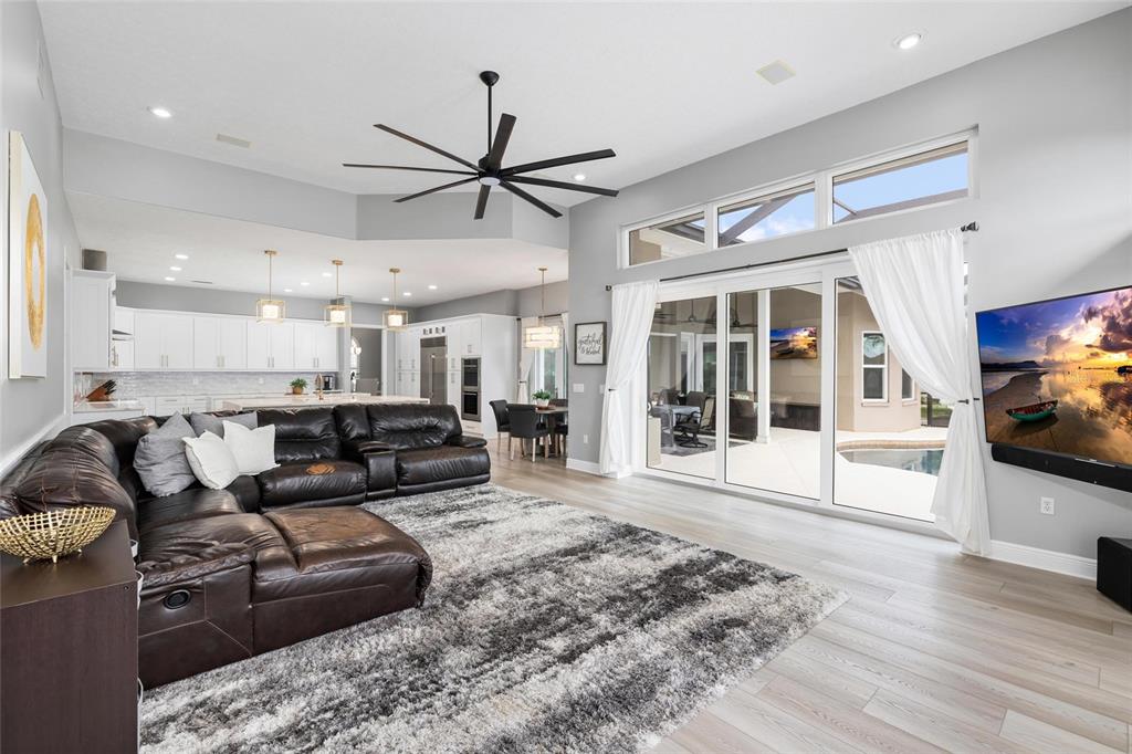 9810 Compass Point Way Tampa, FL 33615 - Photo 22 of 81 a living room with furniture and a fireplace