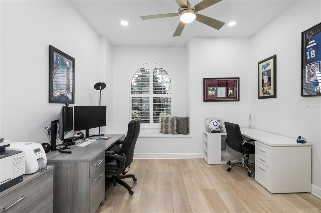 9810 Compass Point Way Tampa, FL 33615 - Photo 23 of 81 a view of a workspace with furniture and a window