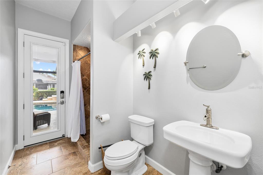 9810 Compass Point Way Tampa, FL 33615 - Photo 24 of 81 a bathroom with a sink toilet and a mirror