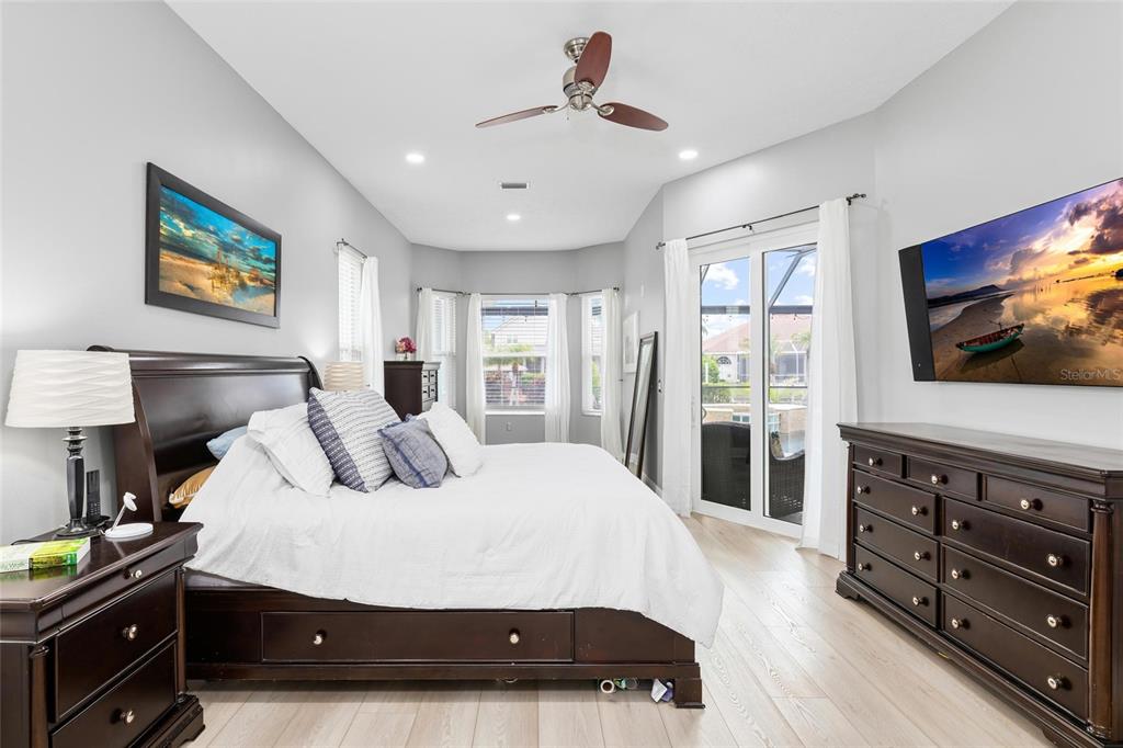 9810 Compass Point Way Tampa, FL 33615 - Photo 27 of 81 a bedroom with a bed and a flat screen tv