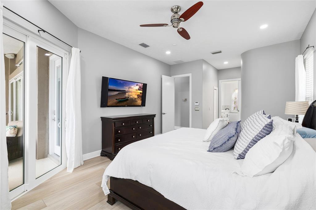 9810 Compass Point Way Tampa, FL 33615 - Photo 28 of 81 a bedroom with a bed and a flat screen tv