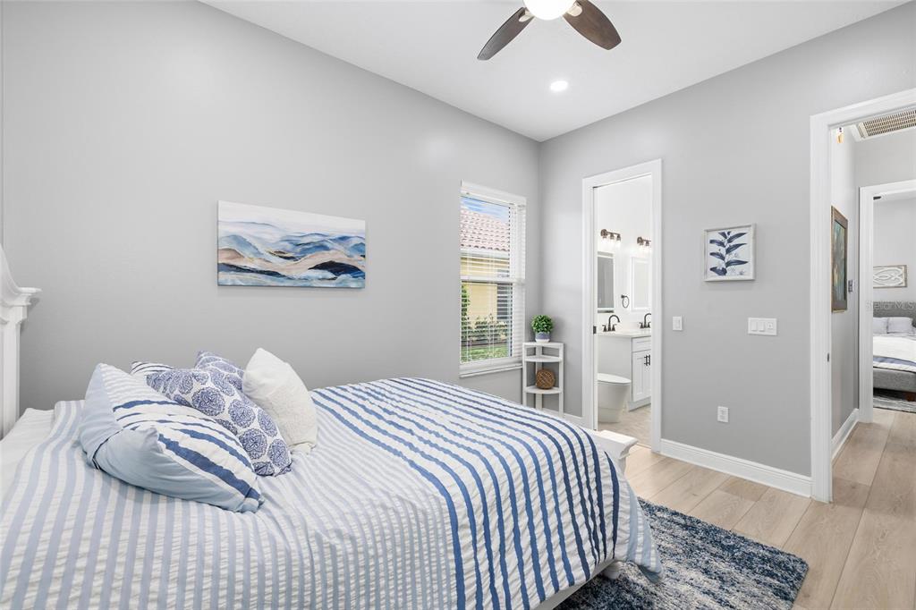 9810 Compass Point Way Tampa, FL 33615 - Photo 37 of 81 a bedroom with a bed and a chandelier