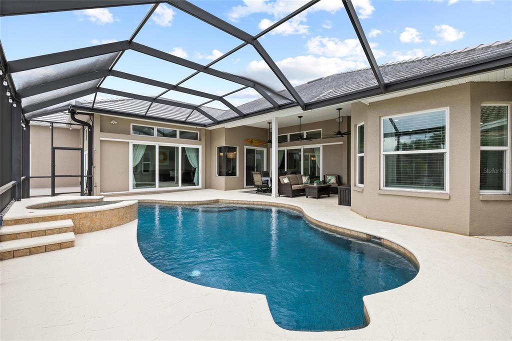 9810 Compass Point Way Tampa, FL 33615 - Photo 44 of 81 a view of a swimming pool with a patio
