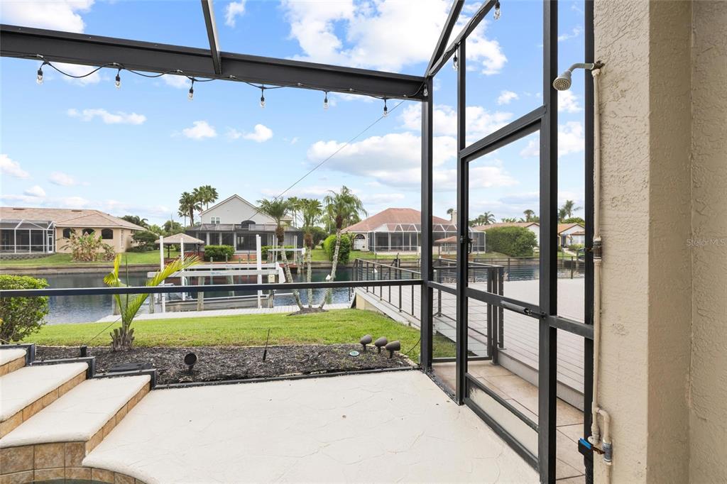 9810 Compass Point Way Tampa, FL 33615 - Photo 48 of 81 a view of a swimming pool with a lounge chairs