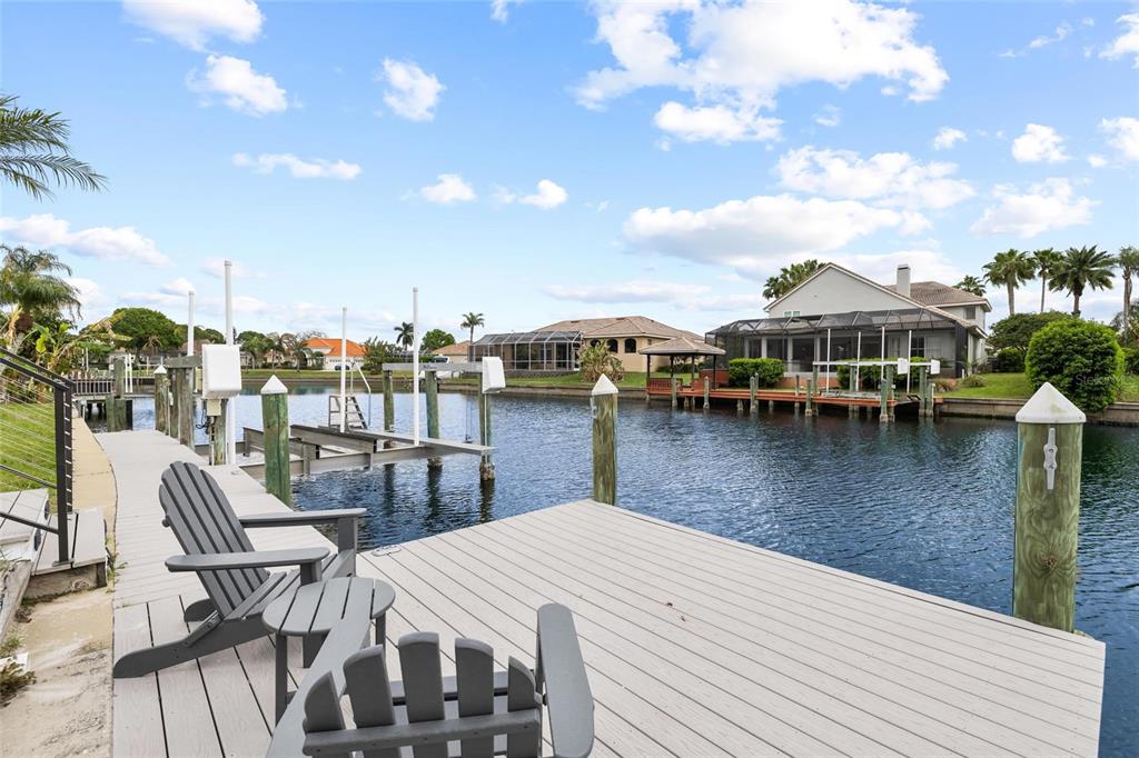 9810 Compass Point Way Tampa, FL 33615 - Photo 53 of 81 a view of a roof deck with table and chairs