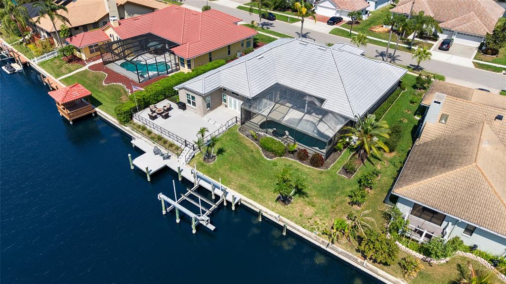 9810 Compass Point Way Tampa, FL 33615 - Photo 64 of 81 an aerial view of a house a yard and lake view