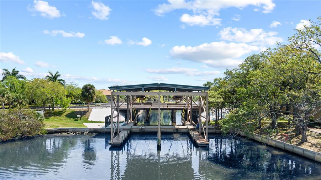 9810 Compass Point Way Tampa, FL 33615 - Photo 79 of 81 a view of a lake with a house in the background