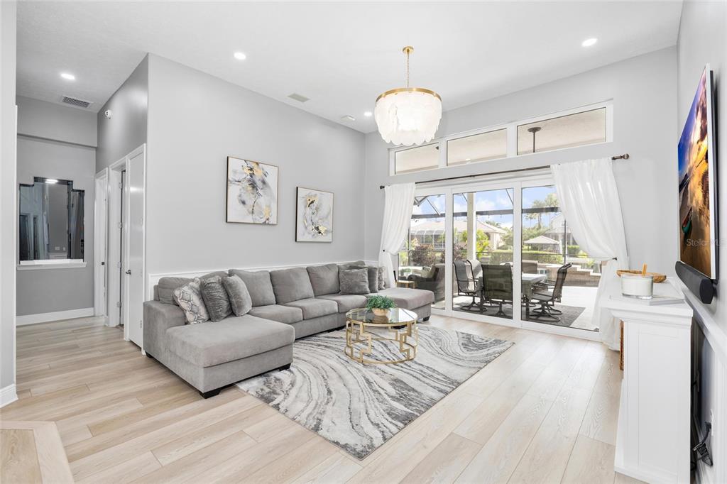 9810 Compass Point Way Tampa, FL 33615 - Photo 9 of 81 a living room with furniture flat screen tv and a large window