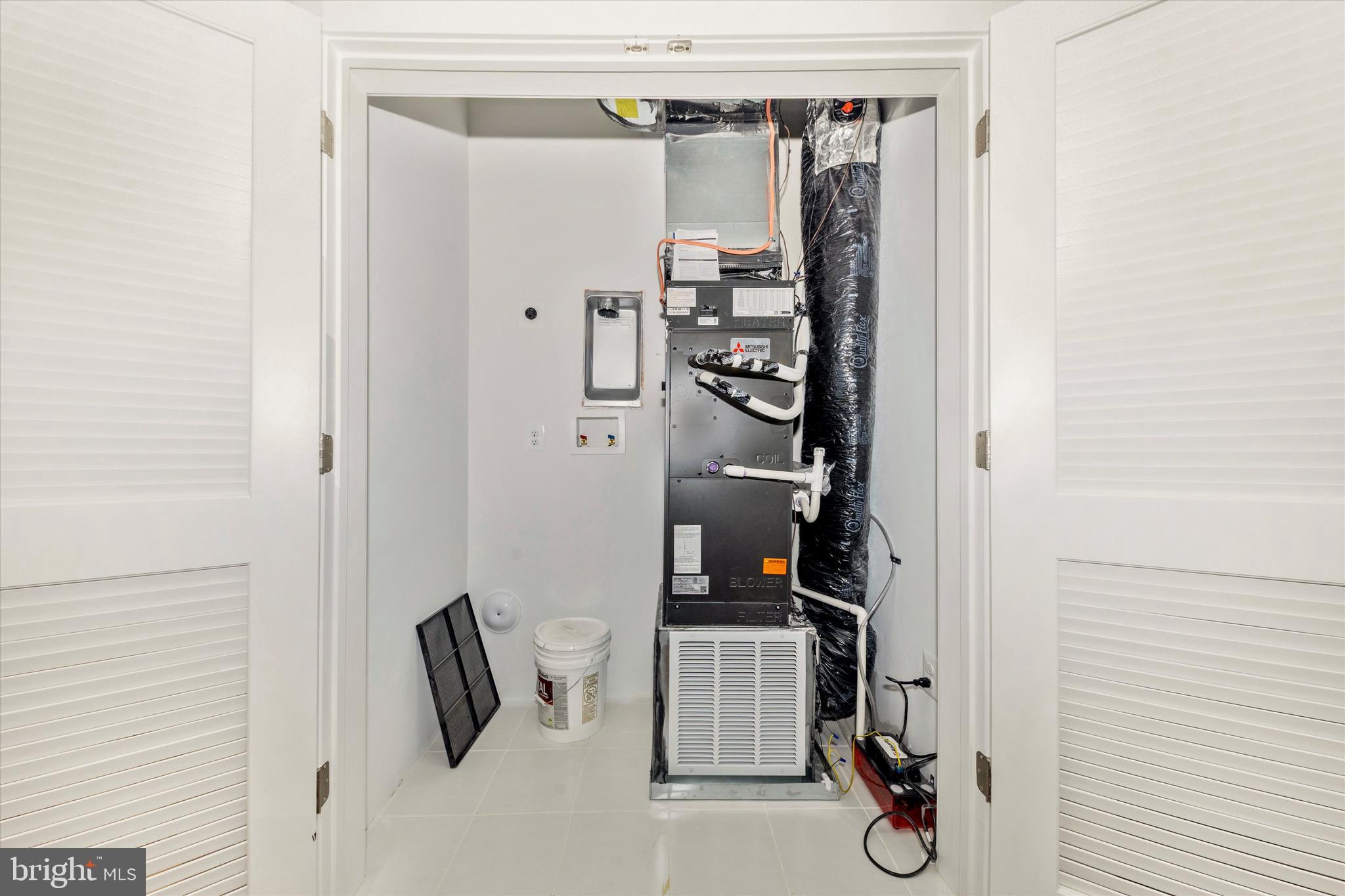 722 Iron Frg Road, Unit 218 Frederick, MD 21702 - Photo 36 of 42 Main level laundry and utility closet.