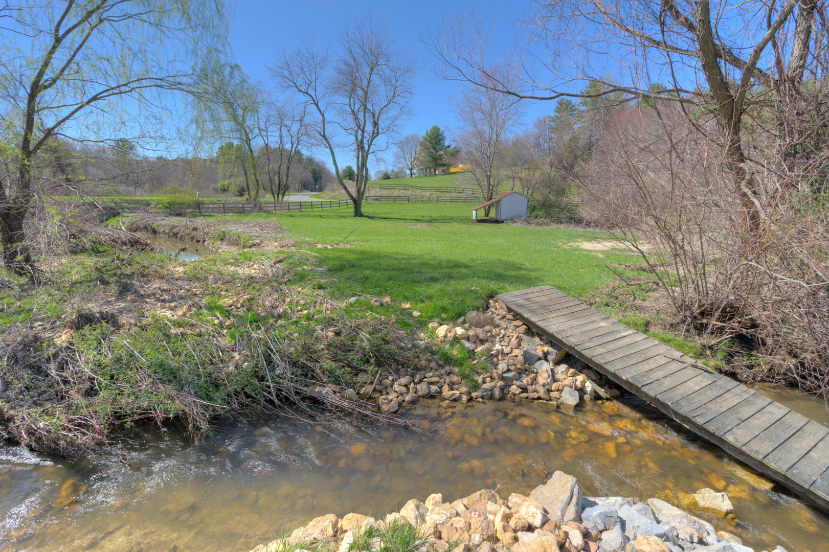 385 Sam Reed Road Northwest Floyd, VA 24091 - Photo 8 of 33 a view of a lake with a yard