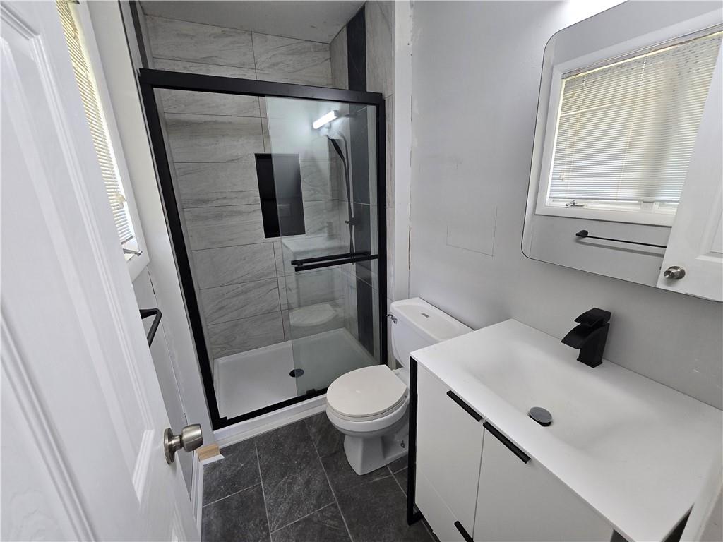 740 South Keel Ridge Road Hermitage, PA 16148 - Photo 11 of 33 a bathroom with a sink a toilet and shower